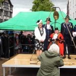 The Mayor of High Wycombe sits in the town's 'weighing chair'.