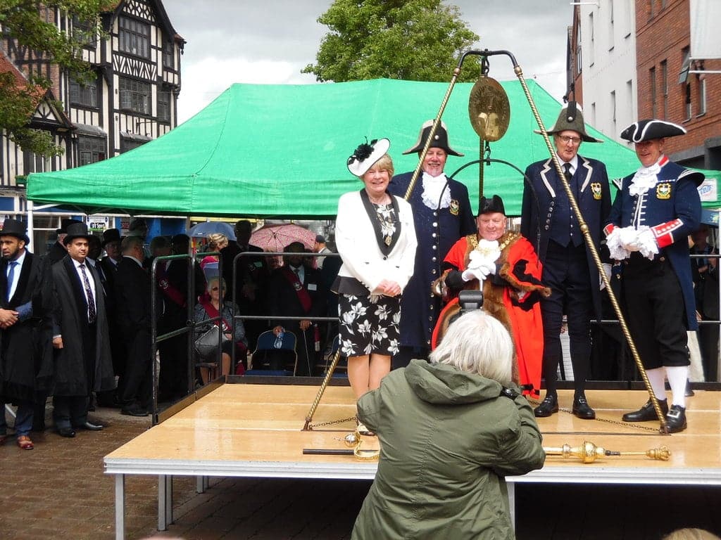 The Mayor of High Wycombe sits in the town's 'weighing chair'.